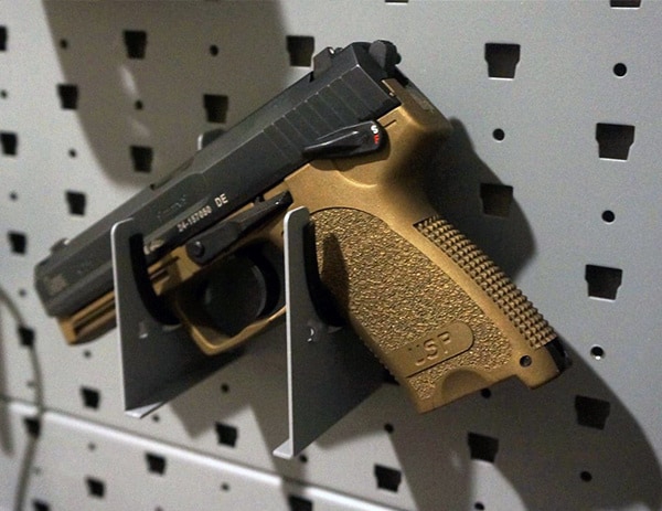 hk usp 9 burnt bronze handgun mounted on pistol hanger