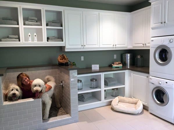 small laundry white wall cabinets gray tile dog wash station 