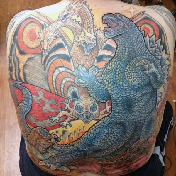 Huge Back Piece Tattoo Of Godzilla With Colorful Background On Man