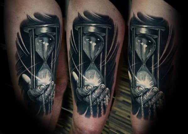 Hyper Realistic Broken Hourglass With Hand Holding Sand Mens Leg Thigh Tattoo