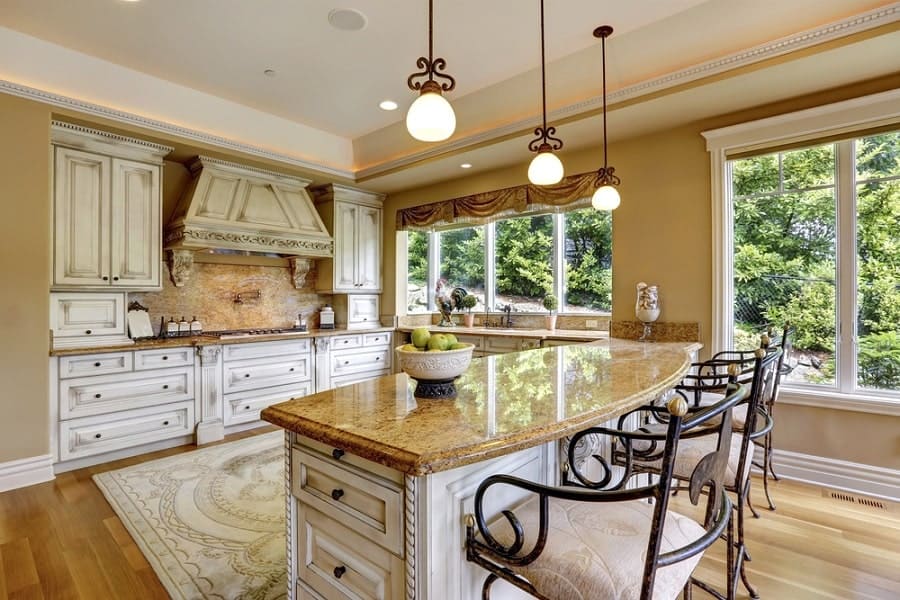 elegant kitchen with white cabinets and polished granite countertops 