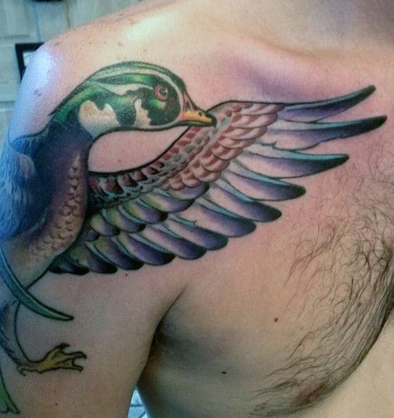 Illustrative Colorful Duck Tattoo On Mans Shoulder Bicep Chest