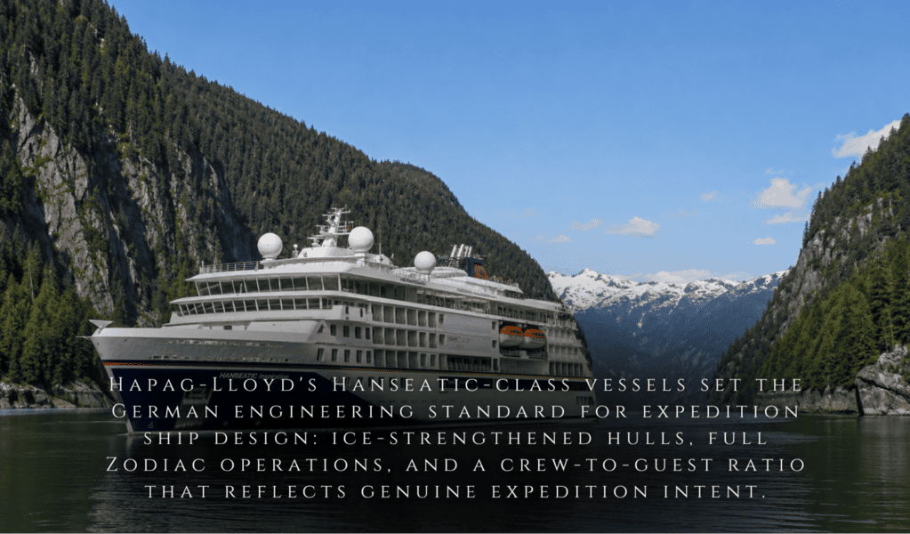 A white expedition cruise ship sails Southeast Alaska’s calm lake, forested mountains surrounding, beneath a partly cloudy sky. Text overlay at bottom