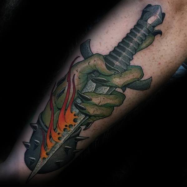 Incredible Guys Green Hand Holding Dagger Outer Forearm Tattoos