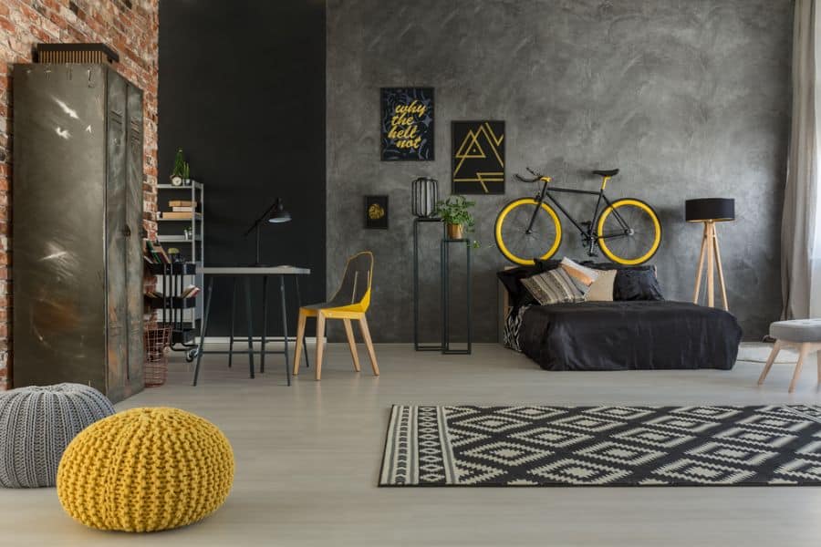gray industrial bedroom bicycle on wall concrete wall