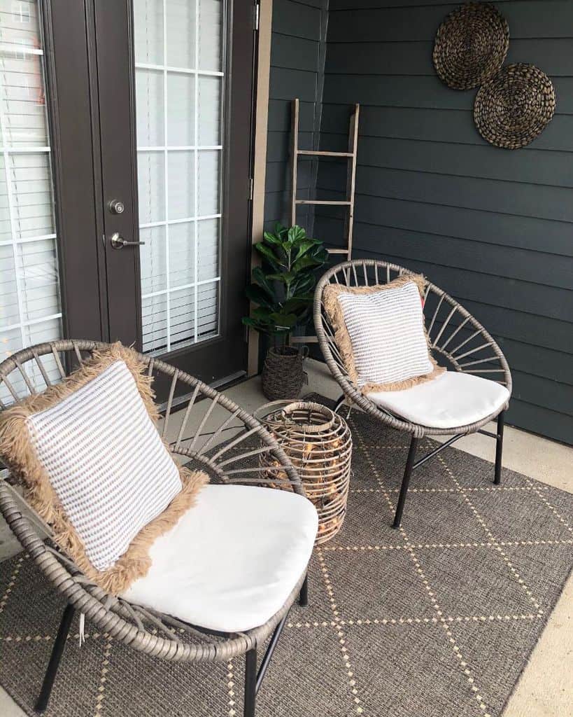 small patio with two cane chairs 