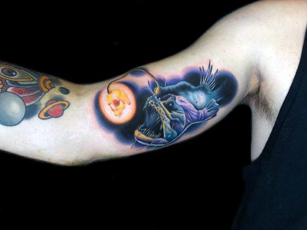 Inner Arm Bicep Angler Fish Tattoo On Men