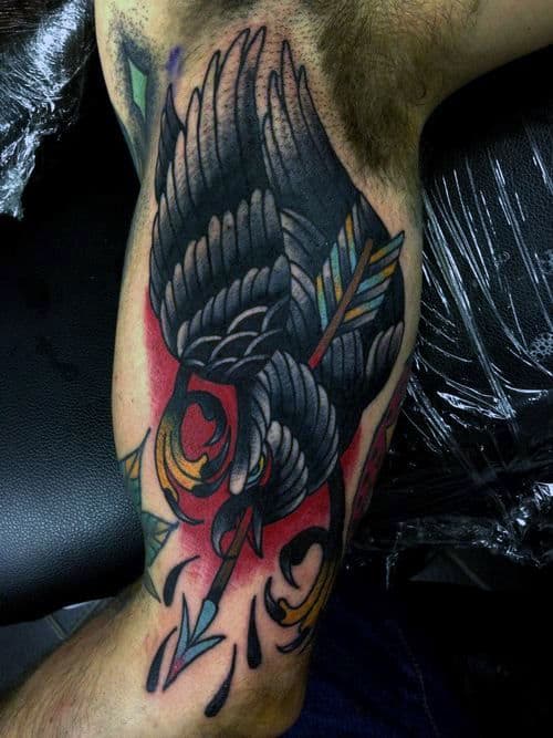 Inner Arm Bicep Traditional Crow Arrows Tattoo On Man