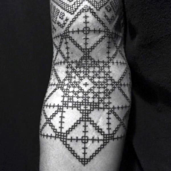 inner-arm-manly-cross-tattoos