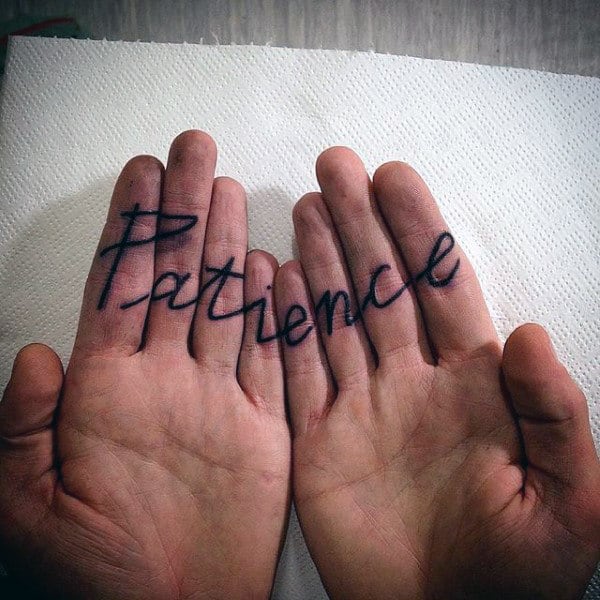 inner-finger-word-tattoos-for-men-with-patience
