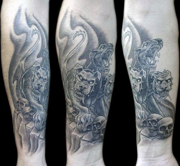 Inner Forearm Shaded Cerberus With Skulls Mens Tattoo Designs