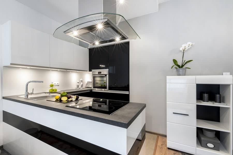 modern kitchen white cabinets black countertop 
