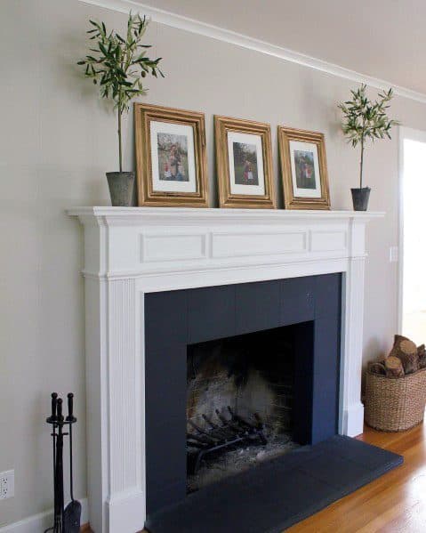 white-painted traditional fireplace 
