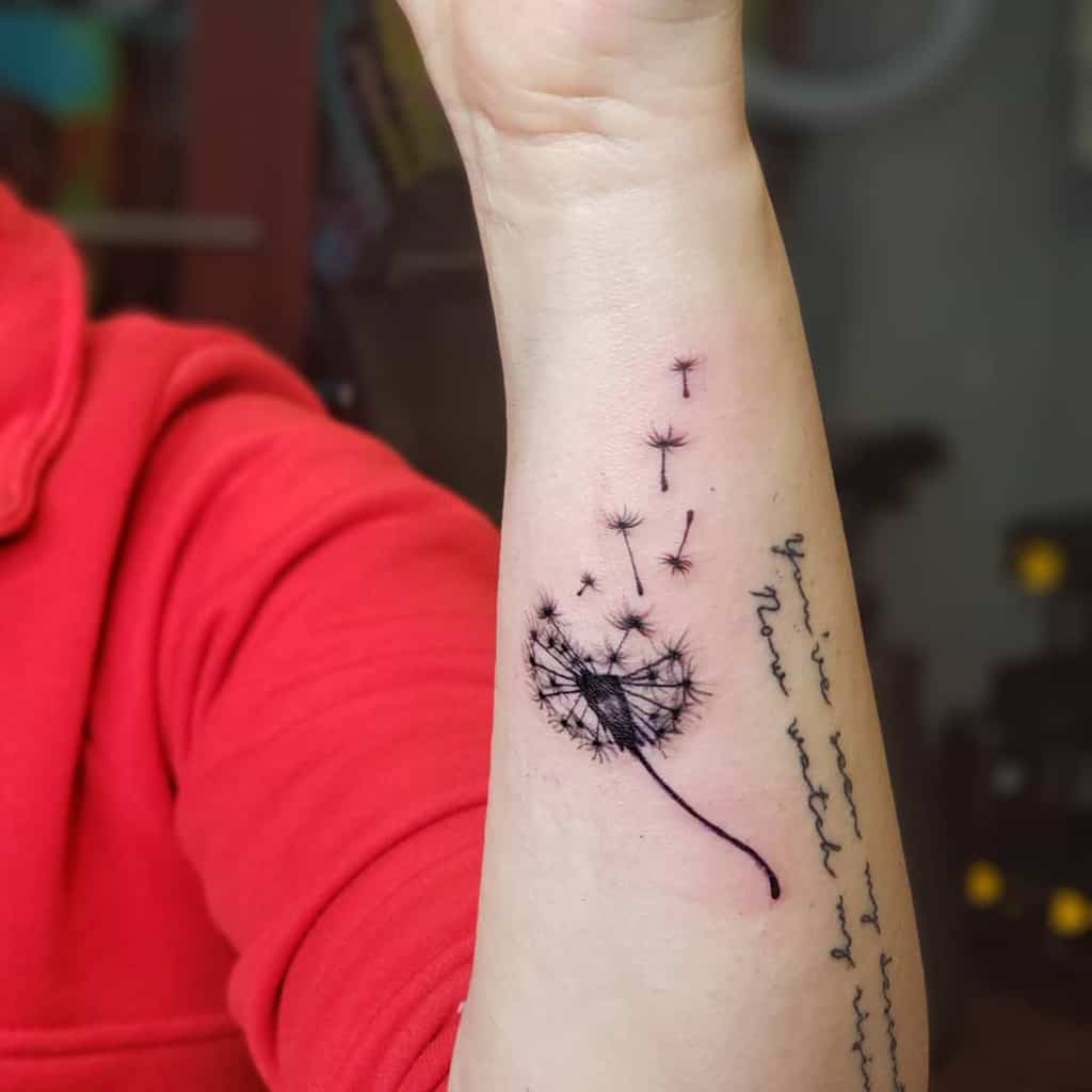 intricate dandelion flower tattoo