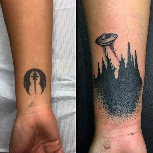 jet black shaded ufo tattoo male forearms