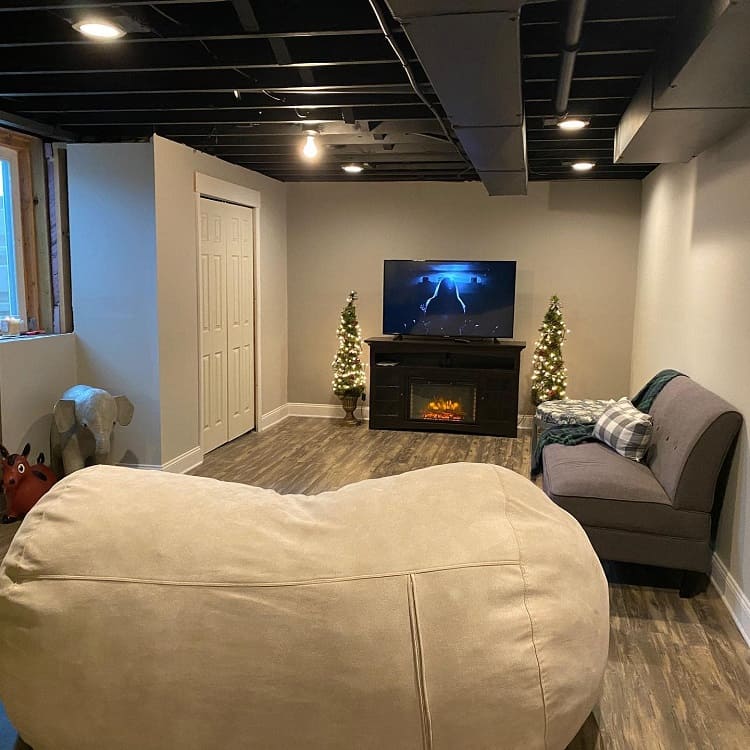 cinema room large bean bag fireplace tv gray couch 