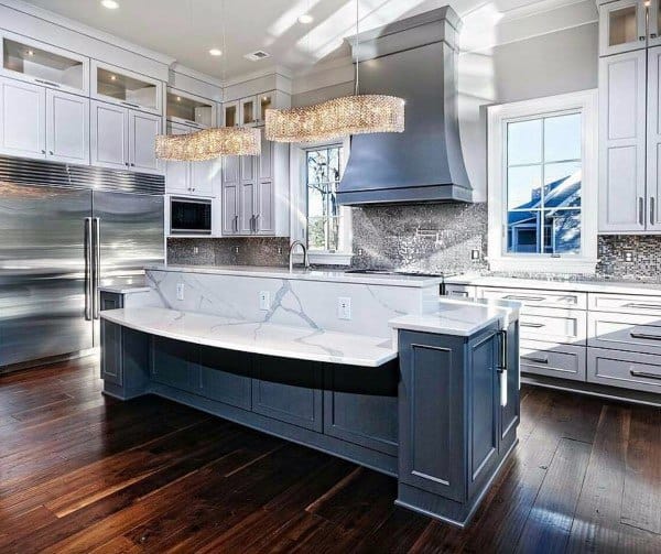large rustic kitchen white cabinets gray island hardwood floors track lighting 