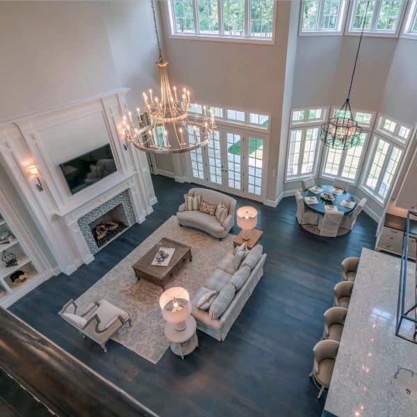 large elegant luxury living room with fireplace and chandeliers