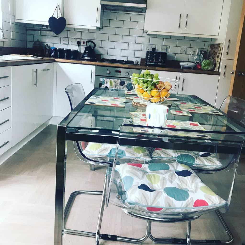 glass table in open kitchen dining room 