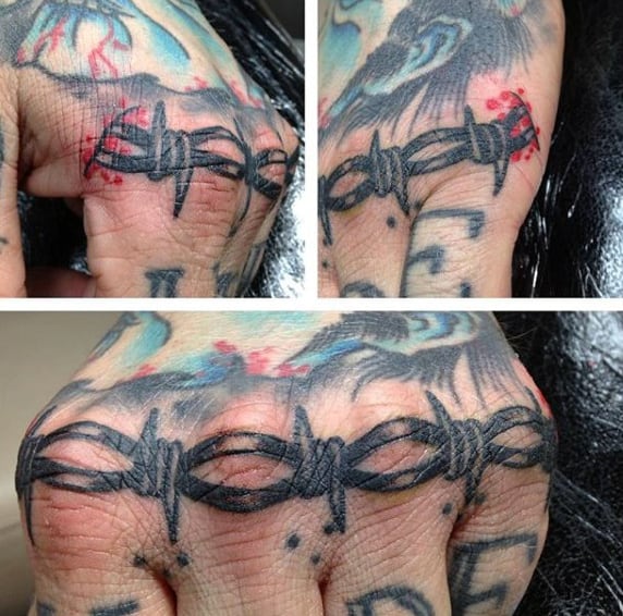 Knuckle Tattoo Of Barbed Wire On Male