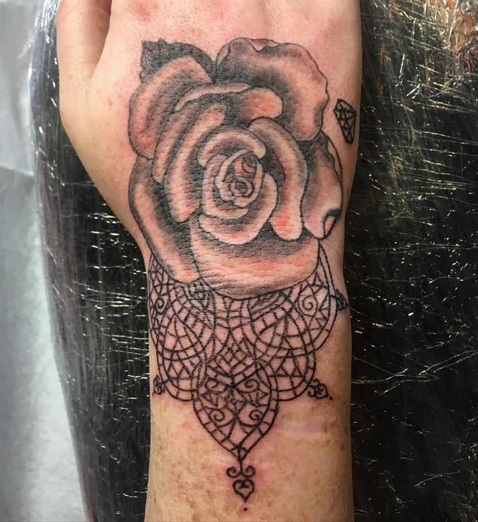 Lace Rose Hand Tattoo