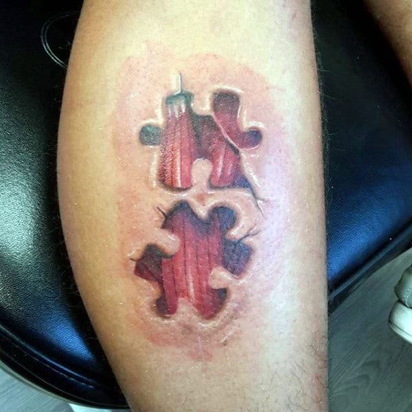Leg Calf Tattoo Of Exposed Muscle Puzzle Piece On Man