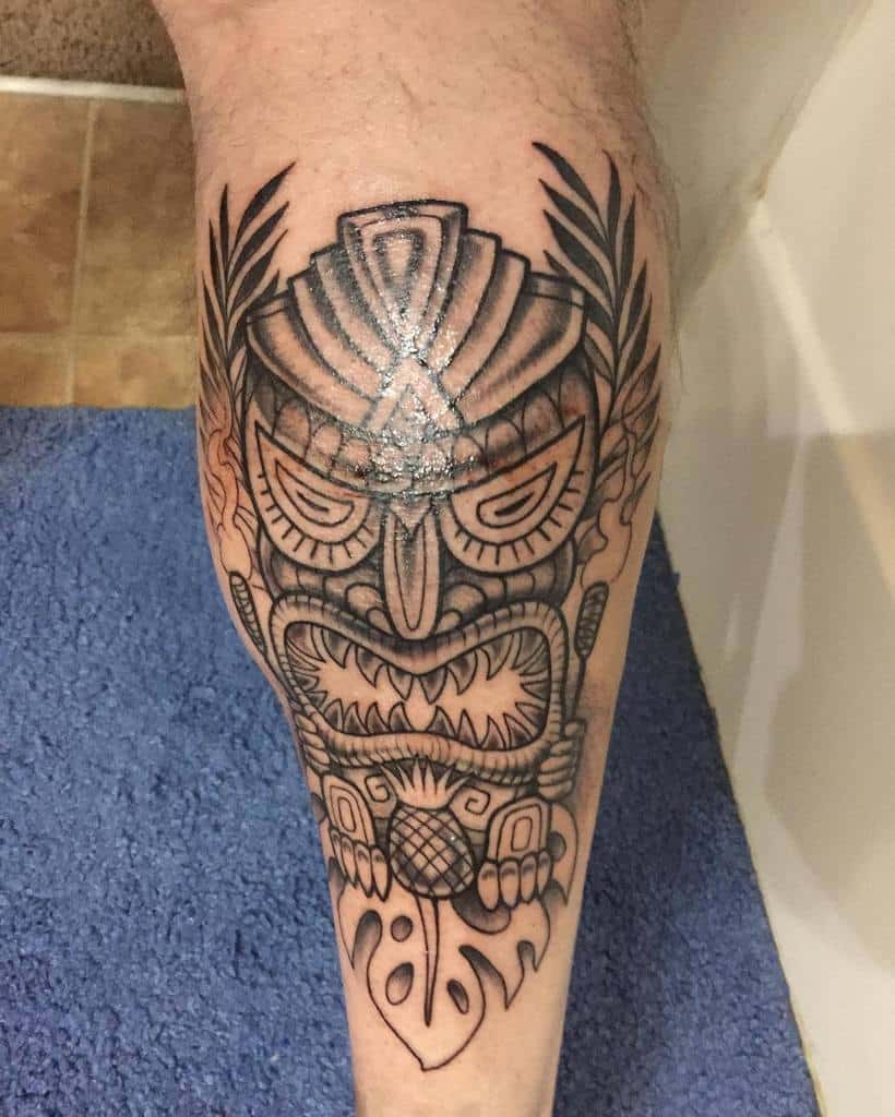 Tiki tattoo on calf · Avalan Tattoo