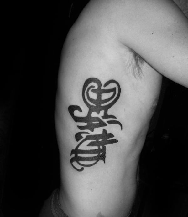 Life And Death Rib Cage Tattoo With Ambigram Design On Male