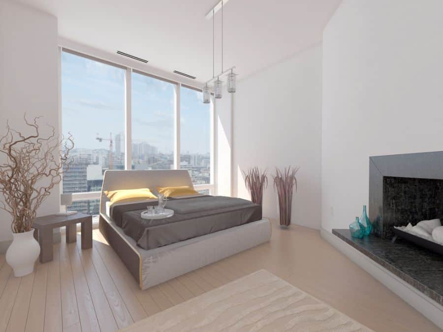 apartment bedroom with fireplace and city view
