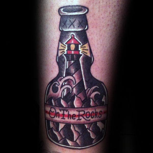 lighthouse-in-a-bottle-on-the-rocks-mens-traditional-forearm-tattoo