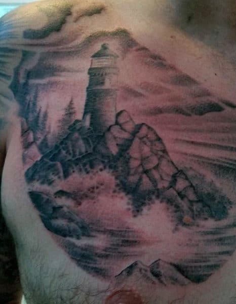 Lighthouse On Rocks Mens Chest Tattoo