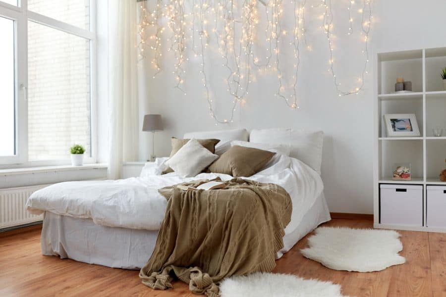 modern minimalist bedroom with fairy lights 