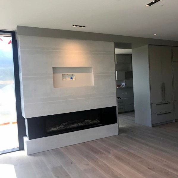 linear fireplace with TV above 