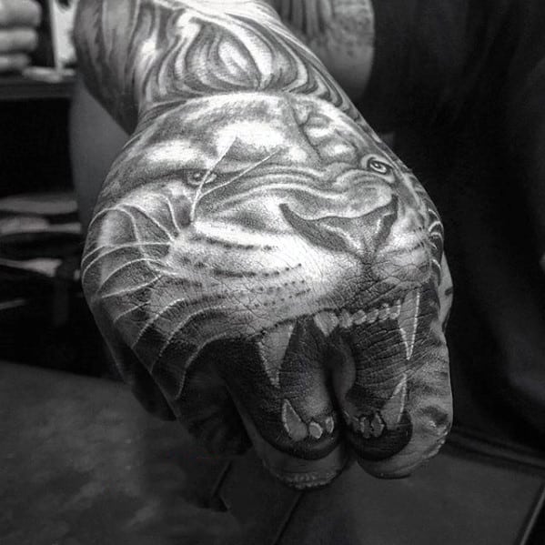 Lion Teeth On Figers Guys Hand Tattoo Designs