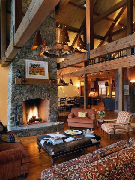 rustic wood cabin living room stone fireplace 