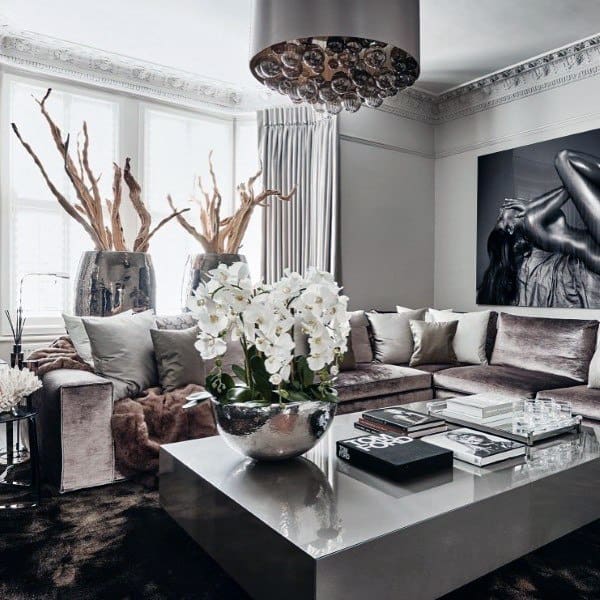 luxury living room with velvet sofa and gray block coffee table
