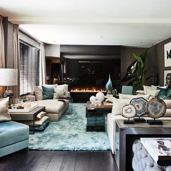 modern living room fireplace turquoise floor rug white couch