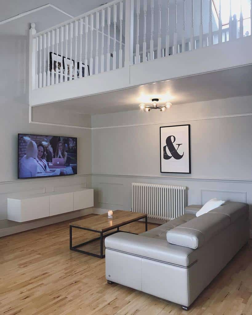 spacious living room gray sofa wall mounted tv