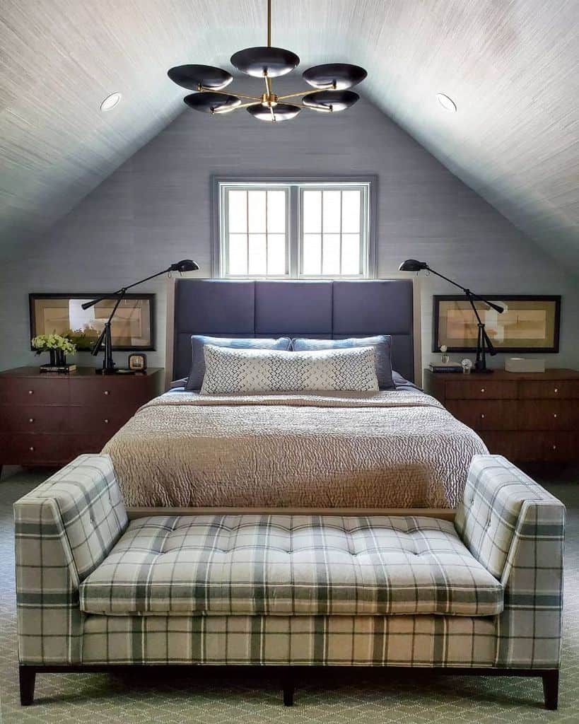 attic bedroom with ottoman 