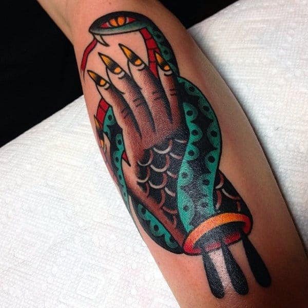 long-yellow-nailed-hands-and-green-snake-tattoo-guys-forearms