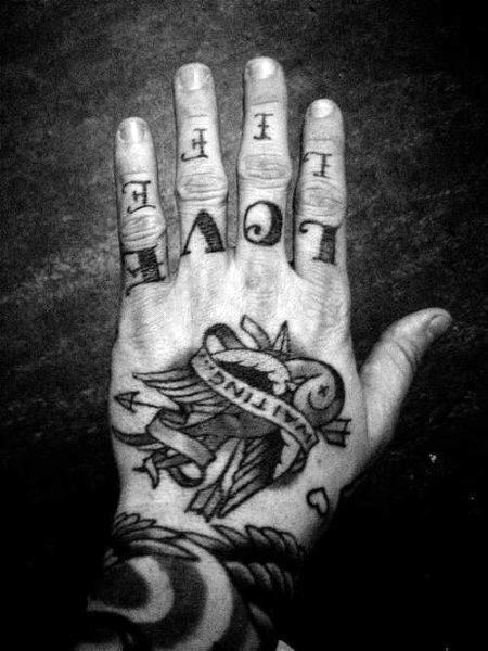 Man With fake Love And Hate Knuckle Tattoos Stock Photo Picture And  Royalty Free Image Image 21928114