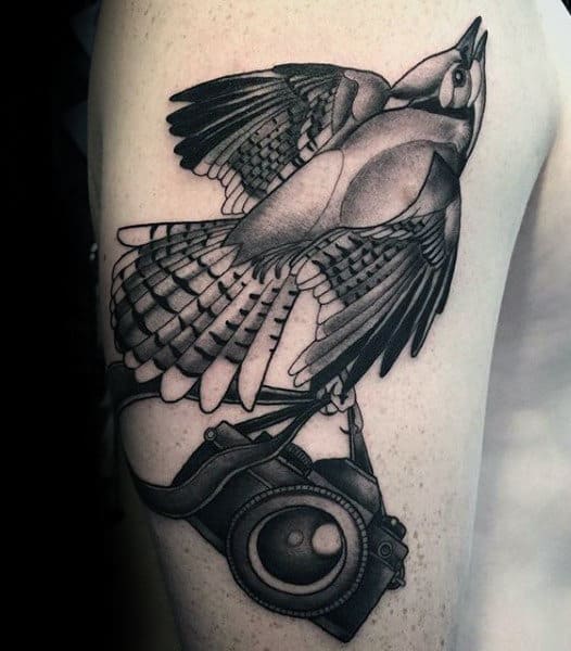 Lovely Bird Holding Camera Tattoo Male Forearms