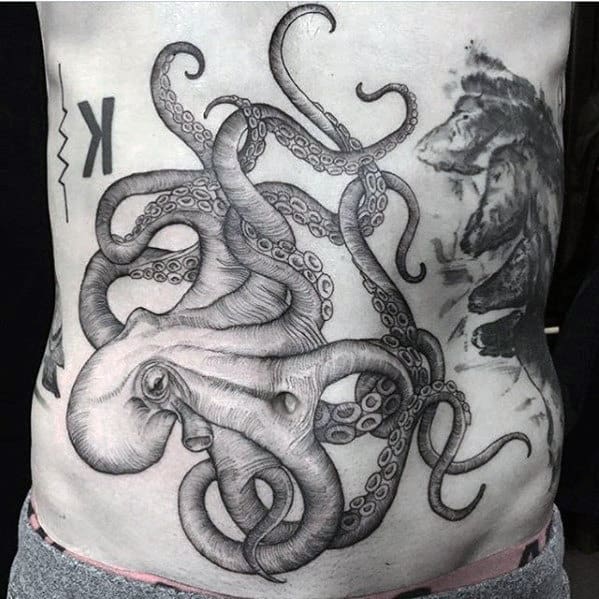Lower Chest Guys Octopus Black And Grey Shaded Detailed Tattoo Designs