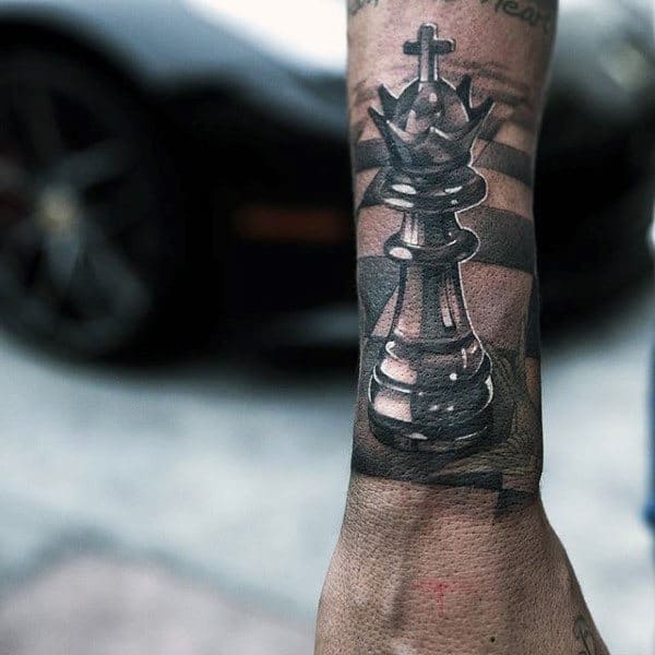 Lower Forearm Male Tattoo Of King Chess Piece With White Ink Shadows