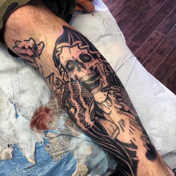 Lower Leg Man With A Grim Reaper Tattoo