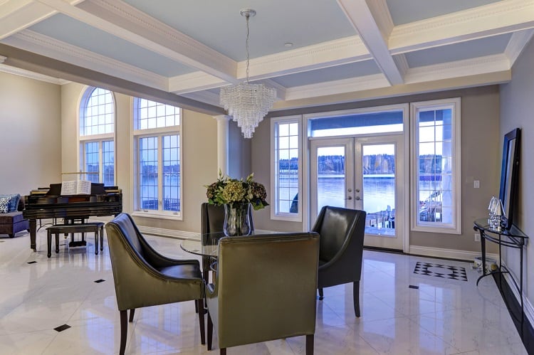 luxury dining area coffered ceiling marble floor chandelier