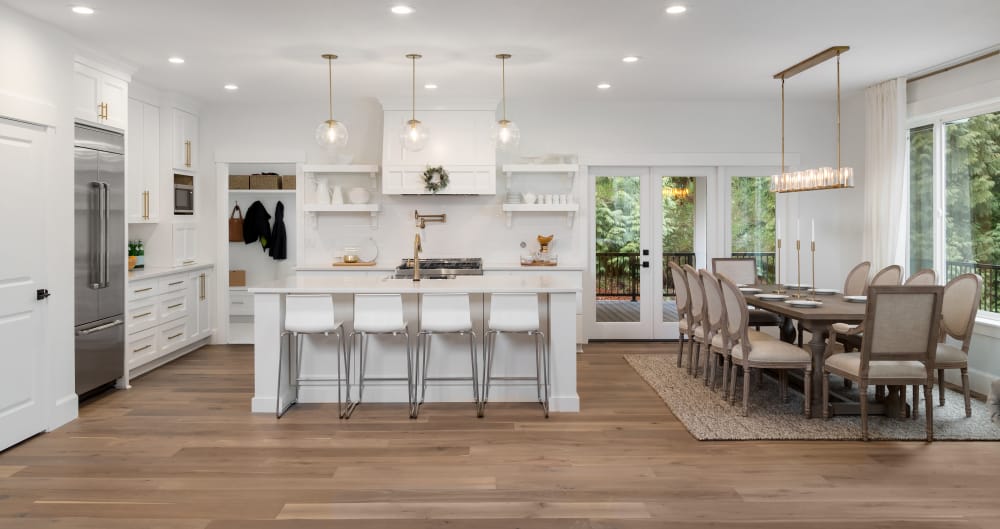 luxury farmhouse kitchen white island and chairs brown dining table pendant lights 