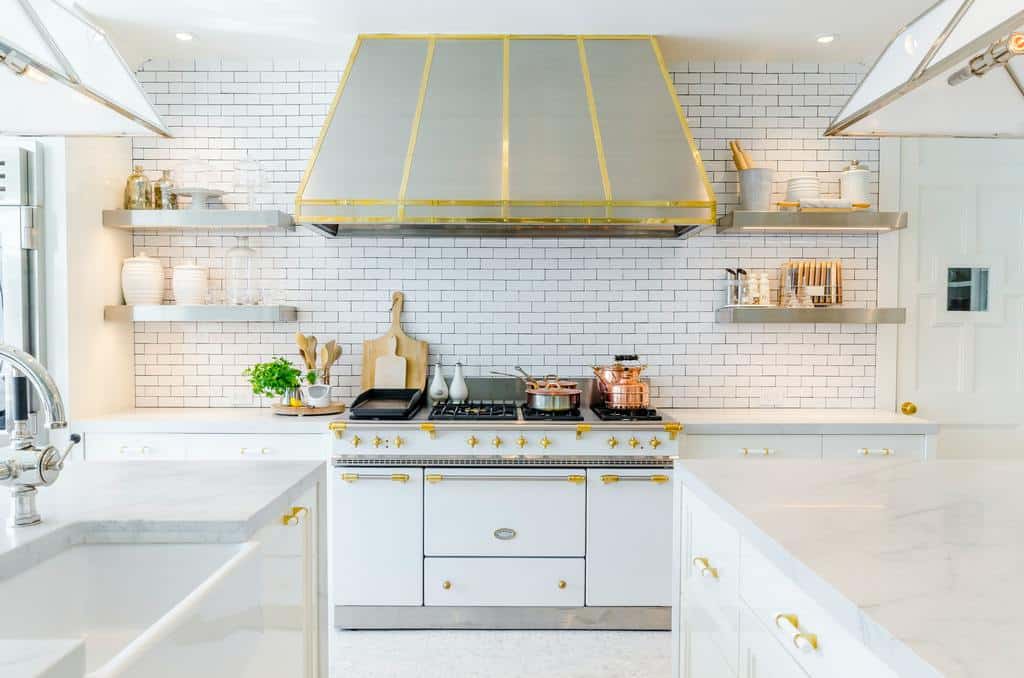 luxury white farmhouse kitchen with gold accents white tile splashback wall 