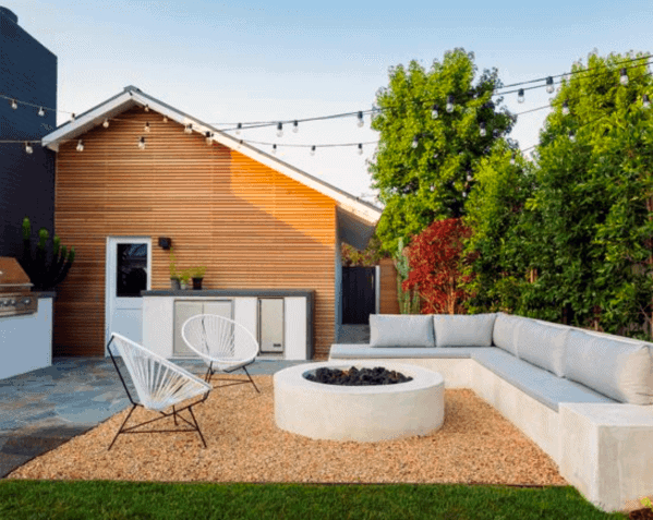 Luxury Gravel Patio With Fire Pit And String Lights