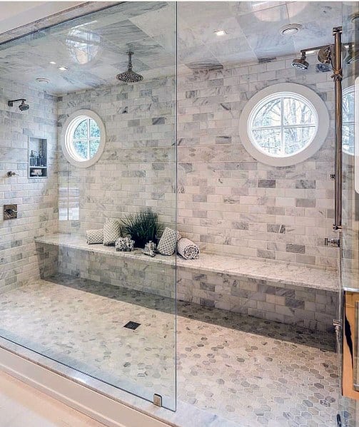 large marble shower with three shower heads